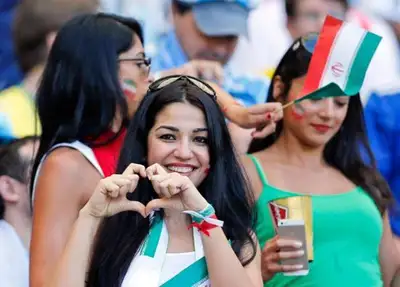 Girl In Galery Shows Love Symbol to Camera