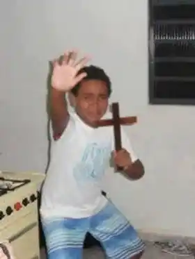 Satan Go Away - Boy with Cross In Hand